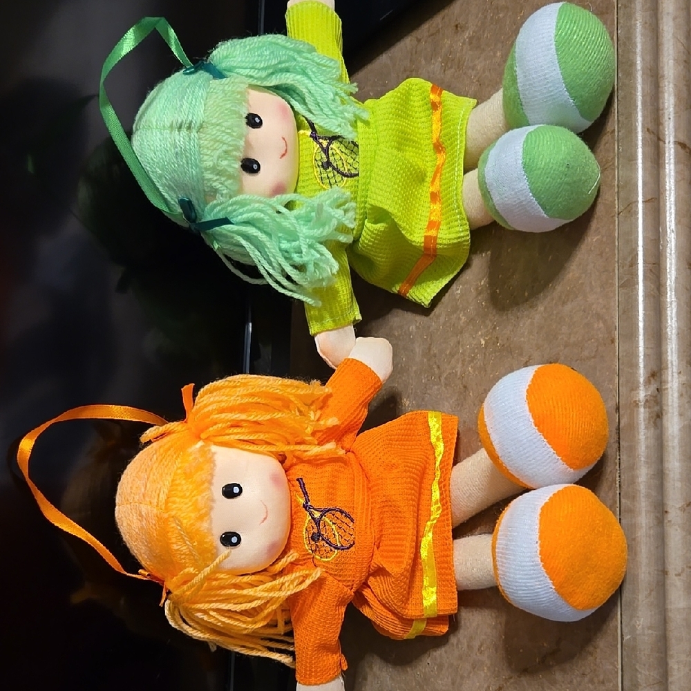 2 Green and Orange Plush Dolls